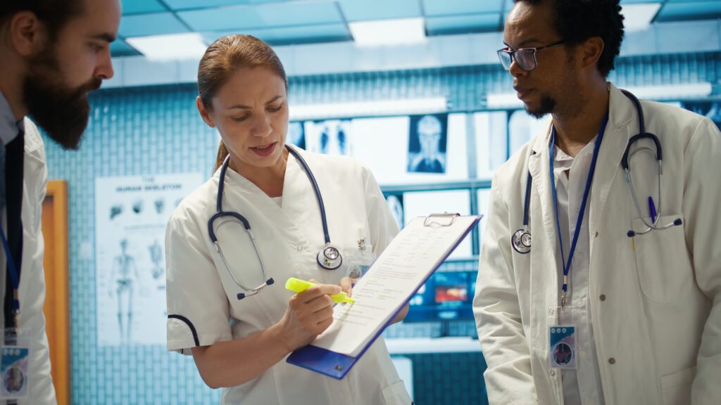 general practitioner highlighting important test results on hospital records